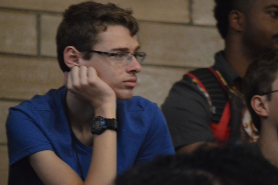 Sophomore Daniel Gibson waits for the pep rally to end Oct. 9. “I’m not really a big fan of loud events,” he said. “I kind of understand the school spirit stuff, but I don’t really care for it.”