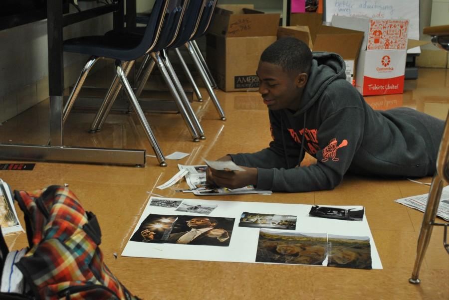 Working on a photojournalism project in Intro to Journalism, Maleak Johnson, sophomore, reflects on the reasons why he prefers U. City to Crossroads College Prepatory, where he previously attended. “The best part of transferring to U. City is running track and playing basketball,” said Johnson. “It’s a bigger school and I like the vibe of the bigger school.”