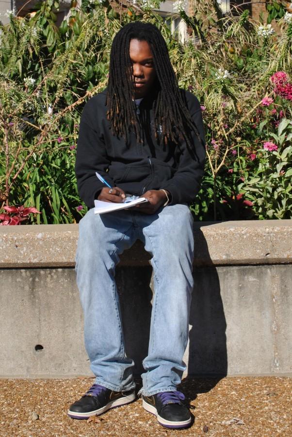 Fidel Muhammad, senior, brainstorms outside of school while meticulously constructing another song. “I like writing outside,” said Muhammad. “It helps to see the world I’m talking about in my music.”
