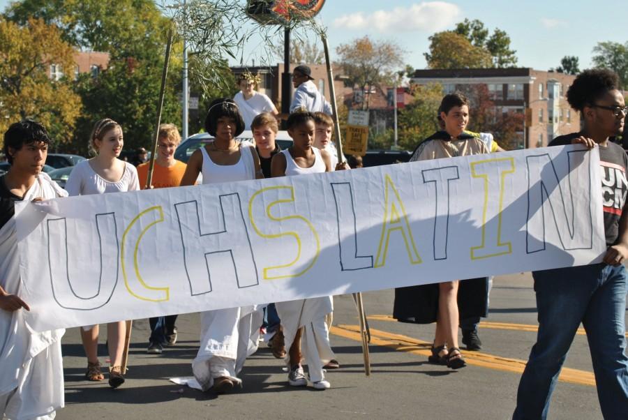 For the first time, Latin Club walks with a float in the parade. “Students took the lead with our float,” said Matthew Tuths, Latin teacher. “We built a mini Mt. Olympus.”