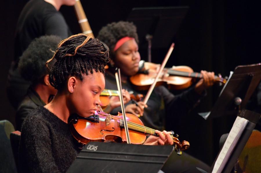 Second violinist Sarah Garner, freshman, plays in her first high school orchestra concert. Garner has been playing the violin since sixth grade. Her favorite song they performed was the theme song to the popular British show, “Downton Abbey.” “This was my favorite piece because it had a beautiful melody,” said Garner. “The first violins started with the melody and then the seconds came in followed by the cellos. It made a beautiful sound.