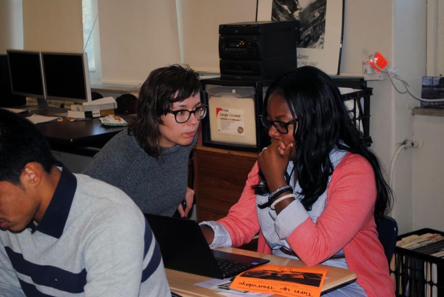 As part of the application process, Jacelynn Allen, senior,  writes her college admission essay with the help of mentor Rici Wittkugel during College Bound, a program to help students navigate the college process. PHOTO BY DELLA COX