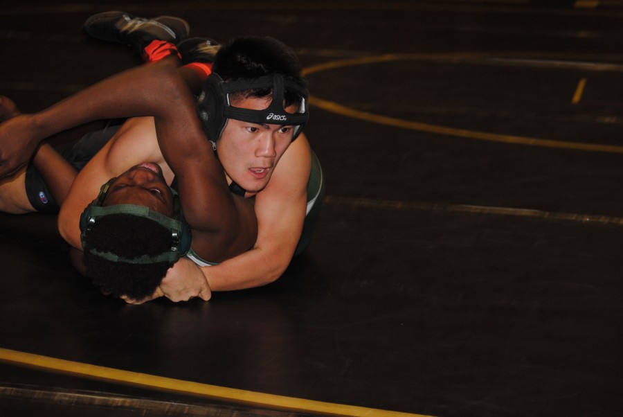 Peter Zhang, freshman, ended his wrestling season early after breaking his arm. His injury happened during a tournament at Normandy. Even after cutting his season short, Zhang still loves to wrestle. “I wrestle to get to state and get my name on the wall,” said Zhang. “In team sports, you don’t get that much individual recognition, but in wrestling you get to be your own person.”