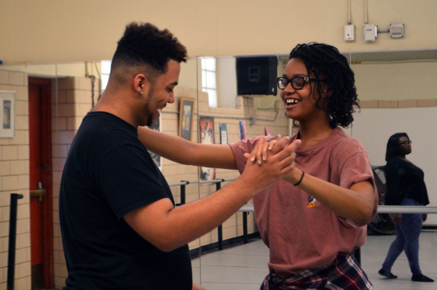 In the dance studio, male lead Joshua Mayfield, senior, learns the waltz for the song Shes in Love from Raven Bullard, junior and female lead