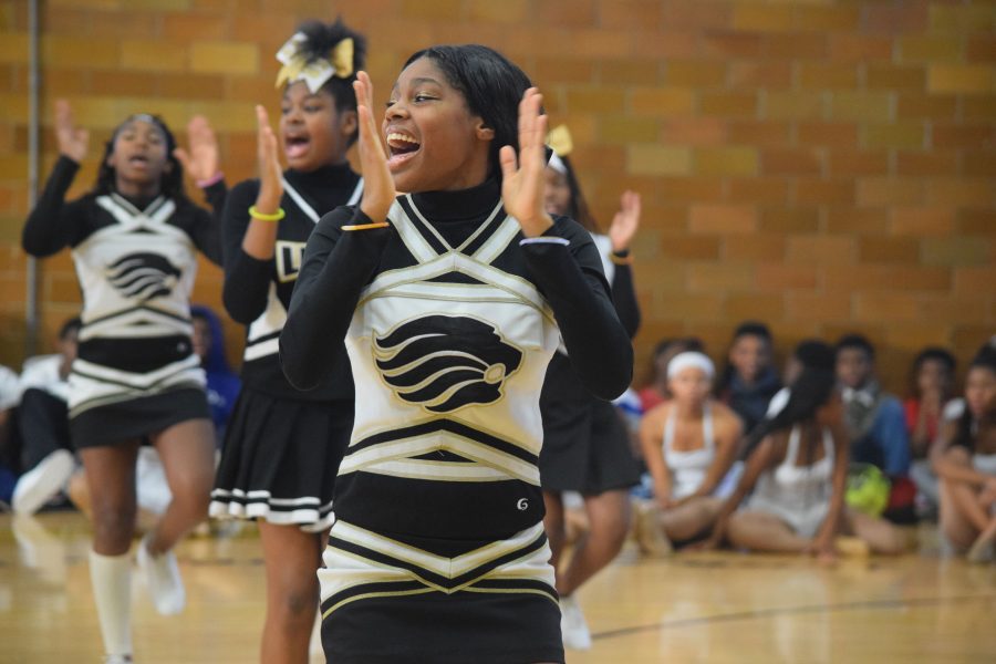 Chanting a tradtional U. City cheer, Jayla Robinson, senior, tries to pump up the crowd.  