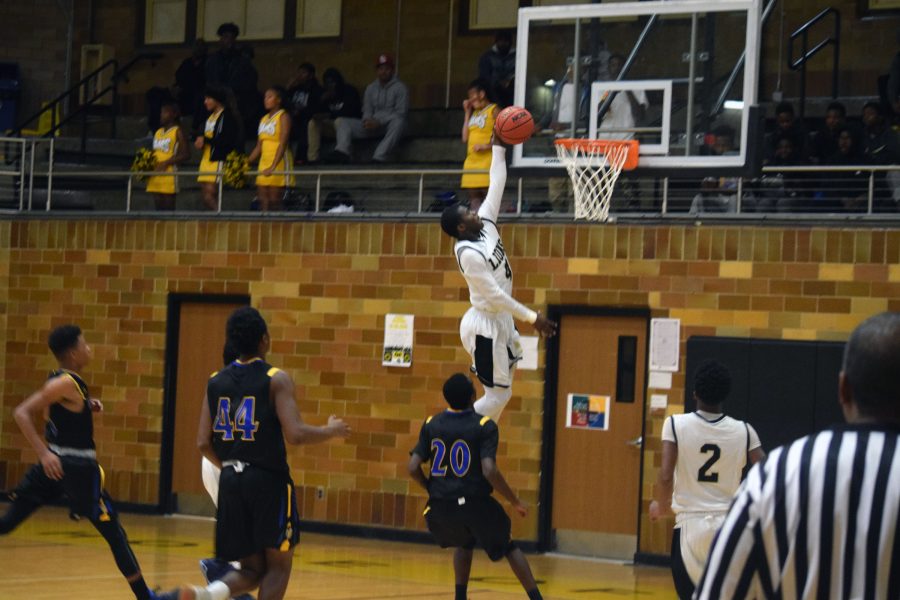 Senior, T.J. Crockett goes up for a dunk against Riverview on Thursday, Dec. 8. 