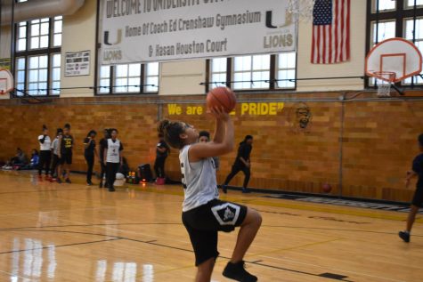 At practice, Ayanna Williams, junior small forward, goes in for a lay up. “A jump shot is my favorite shot because it’s closer to the basket and easier to score,” Willams said. “ You are supposed to put your all into the shot.” 