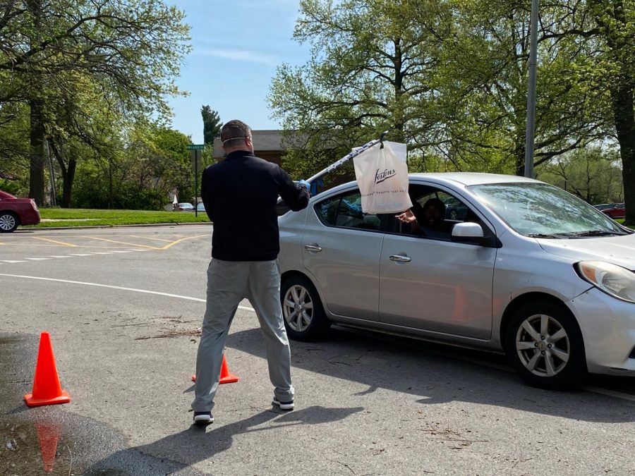 Seniors receive caps and gowns in a creative way