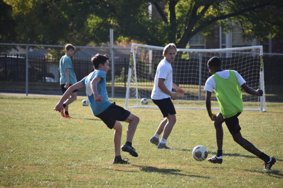The boys soccer team seen here at one of their first scrimmages of the season. "I was very excited to be able to play again because all we've been doing for the past month was conditioning" said Nate Martin, senior.  