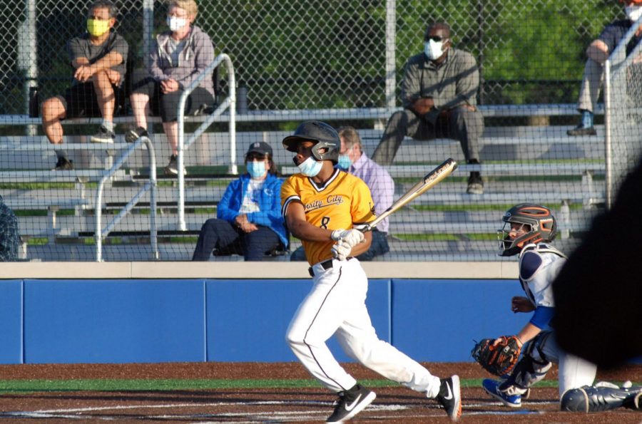 Josh Rhiney, senior, lines a ball to the shortstop in a 7-5 victory over Clayton on May 5.