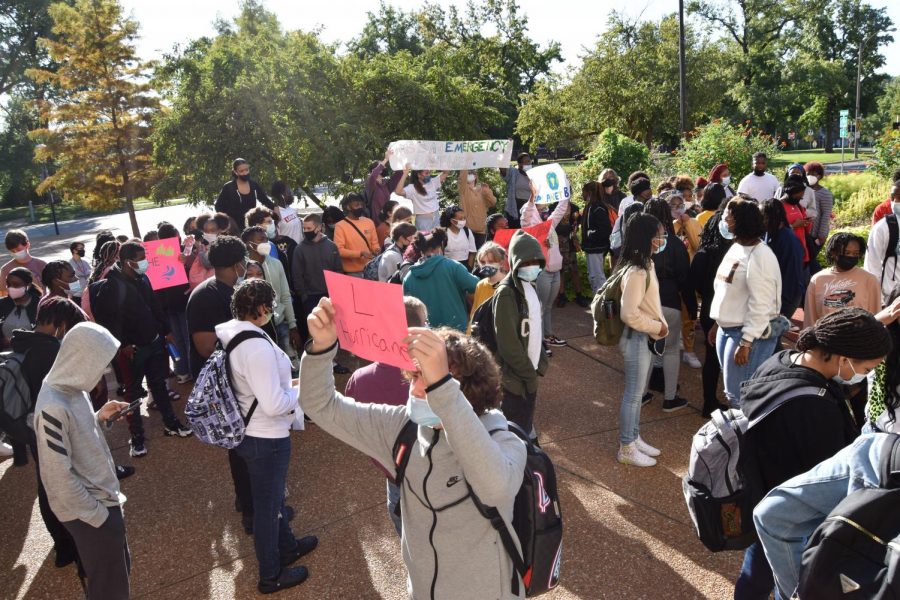 Students raise signs around there heads as the climate strike goes on 