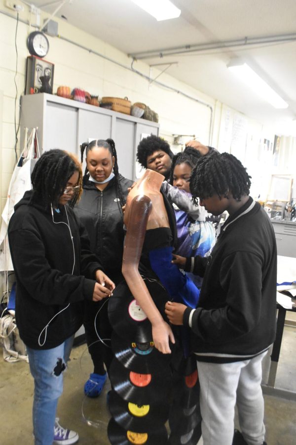 All the participants put the finishing touches on the record skirt. Each of the nine members has their own motivations for working on the project. Jordan Hughes, freshman, felt the work has given her inspiration for her future years at U. U. City. In the future, I would love to work with different materials, Hughes said.